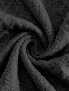 Dark grey men's hoodie knitted fabric close-up showing fine texture and pattern.