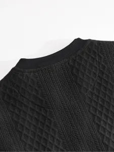 Detailed view of the black men's knit sweatshirt collar, showing textured fabric pattern.