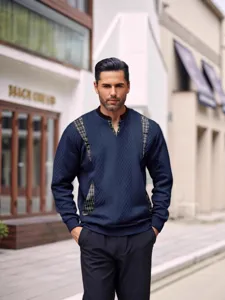 Stylish men's long-sleeve knit sweater with plaid panel details, casual streetwear top.