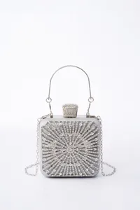 Crystal evening clutch bag detail, silver rhinestone box purse with metal handle and chain.