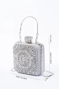 Silver rhinestone evening clutch bag with metal handle and chain strap for wedding party.