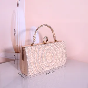 Sac pochette de soirée élégant orné de perles avec poignée en cristal pour femmes.