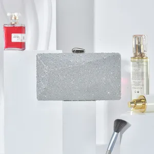 Detail shot of silver rhinestone evening clutch bag sparkling party wedding purse accessories.