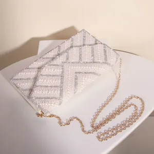 Elegant pearl rhinestone evening bag, luxury diamond-encrusted wedding party clutch purse with chain.