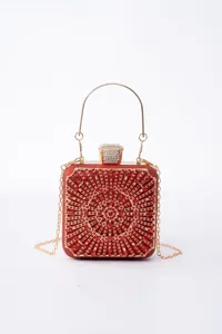 Sparkling red crystal clutch bag with gold chain and handle, elegant evening bag for party.