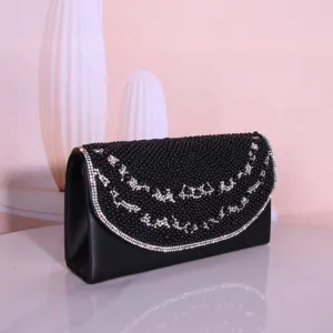 Exquisite black beaded evening clutch bag detail, showing sparkling rhinestones and elegant design.