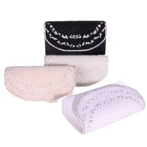 Elegant rhinestone evening clutch bag with pearl beading, perfect for weddings and parties.