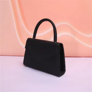 Borsa da sera in pelle nera dettaglio, elegante borsetta con manico per feste donna.
