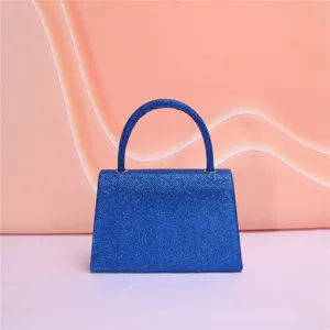 Shimmery blue glitter evening handbag with structured trapezoid flap and top handle for party.