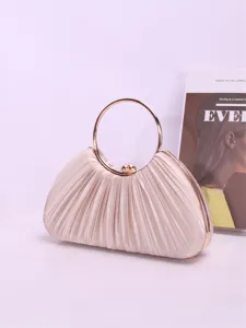 Pleated satin evening clutch bag with metal ring handle, elegant party handbag detail.