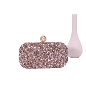 Sparkling crystal rhinestone evening clutch bag with elegant pearl clasp for party.