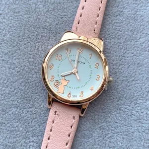 Close-up of pink leather strap quartz watch with cute cat ear case and white dial.