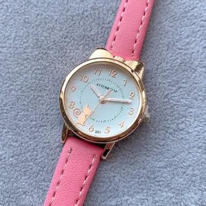 Cute cat quartz watch detail shot, pink leather strap and clear white dial closeup display.