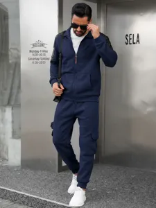 Mens casual sportswear tracksuit set solid color zip up jacket and cargo pants autumn winter.