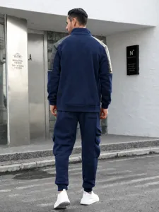 Detailed view of the men's casual tracksuit back showing shoulder paneling and functional pockets.