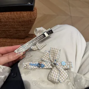 Korean style plaid bow hair clip with cute crystal and flower charms for sweet daily wear.