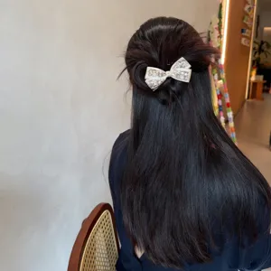 Sparkling rhinestone bow hair tie, elegant crystal scrunchie for women and girls bun styling.