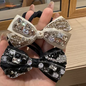 Rhinestone bow hair tie set, elegant black and champagne crystal hair rubber band details.