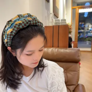 Detailed view of the Korean style braided wide headband, featuring retro houndstooth pattern.