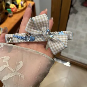 Korean style plaid bow hair clip with rhinestones and sweet design for daily hair styling cute.