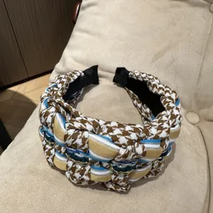 Chic woven wide headband, houndstooth and colorful ribbon design for retro fashion look.