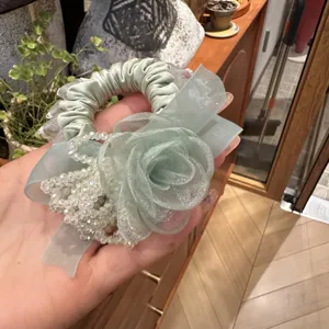 Elegant green floral hair scrunchie with sparkling crystal beads and sheer organza fabric.