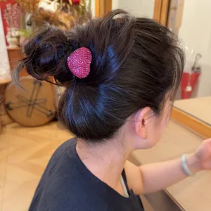 Stylish pink rhinestone heart hair tie for elegant ponytails and buns daily wear accessory.
