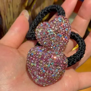 Sparkling rhinestone heart hair tie elastic scrunchie for women girls ponytail fashion accessory.
