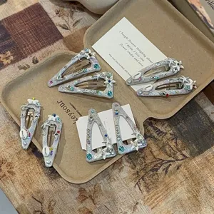 Korean style cute triangle glitter hair clips with rhinestones and starfish charms for women.