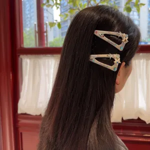 Korean style glitter triangle hair clips with cute pearls and star charms for women.
