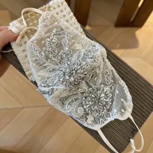 Rhinestone lace decorative face mask for women, elegant sparkling crystal floral design.