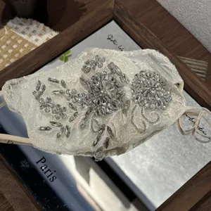 Exquisite rhinestone lace decorative face mask, featuring sparkling crystal embroidery.