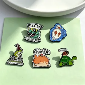 Close-up detail of cute cartoon animal enamel pins featuring funny dinosaur and duck designs.