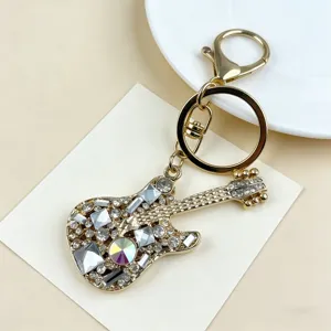 Close-up detail of the rhinestone guitar keychain showcasing sparkling crystal embellishments.