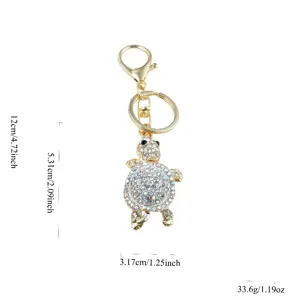 Detail view of the rhinestone turtle keychain, showing precise dimensions and crystal embellishments.