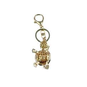 Golden metal turtle keychain pendant cute alloy key ring stylish bag accessory gift.
