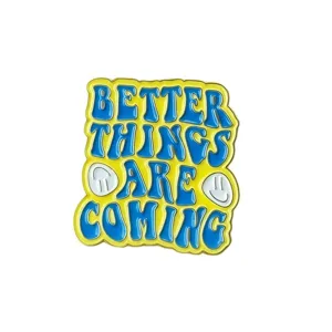 Close-up detail of the retro metal enamel brooch featuring creative English typography.