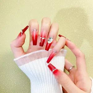 Burgundy gradient press-on nails with sparkling rhinestones, detailed close-up shot.