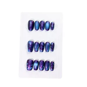 Handmade press-on fake nails with blue purple cat eye effect and elegant painted floral patterns.