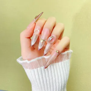 Uñas postizas hechas a mano almendra larga ojo de gato rosa nude degradado estrás lujo
