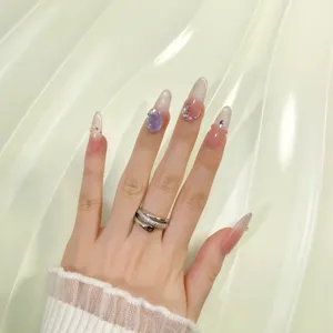 Handmade long press-on nails featuring cat-eye gradient, dazzling rhinestones, and sapphire gems.