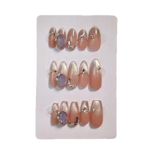 Handmade cat-eye press-on nails with blue crystals and pearls, elegant daily wear fake nail tips.