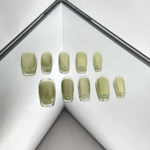 Avocado green cat eye press on nails detail showcase showing sparkling glitter edge design