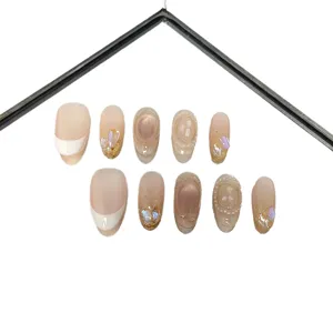 Nude French press-on nails with cat-eye effect, glitter and rhinestones for daily fairy style.