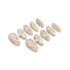 Nude pink press-on nails set with 3D flower and star rhinestones, sweet fairy style fake nails.