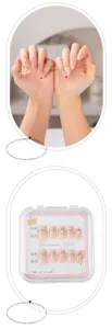 Handmade press-on nails with pink gradient and cute rhinestones, perfect for sweet fairy nail art look.