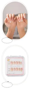 Handmade press-on nails featuring nude pink gradient French design with bows and pearls for daily chic.