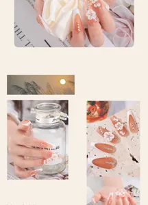 Handmade 3D floral press-on nails with french tip and rhinestones for elegant daily wear.