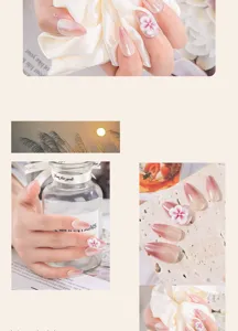 Close-up detail of handmade ombre pink press-on nails with elegant 3D white carved floral art.