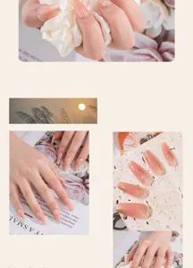 Vista detallada de uñas postizas hechas a mano, longitud media, rosa nude con líneas doradas.